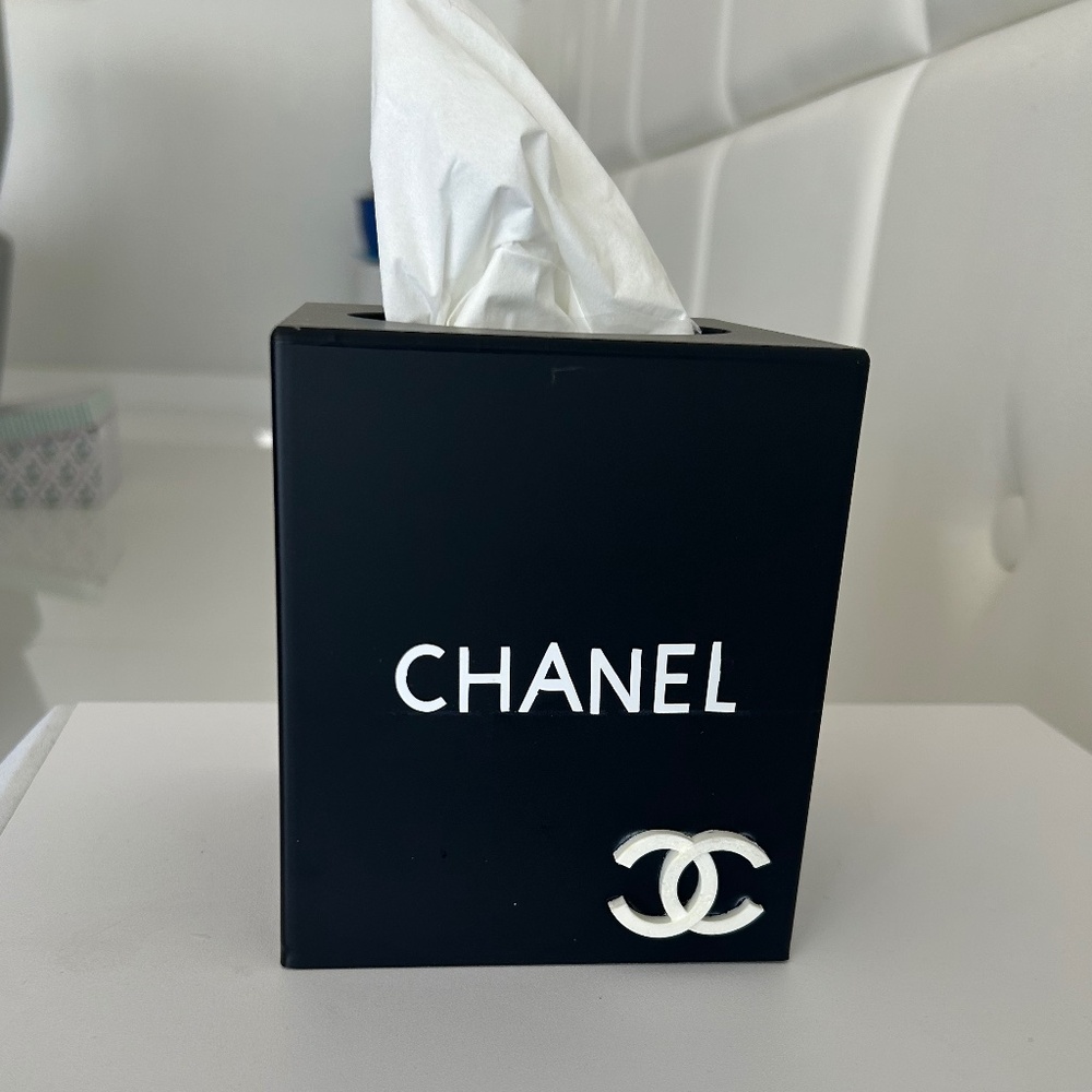 Black tissue box with white letters and raise CC